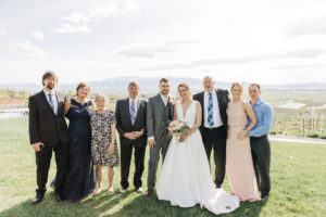 Kayleena and Dominique with family on their wedding day at Mt Naomi Vineyards
